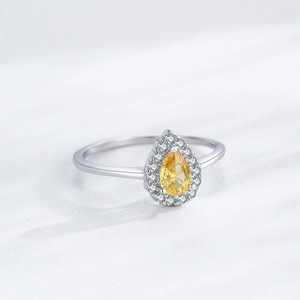 S925 sterling silver ring with a pear-cut yellow diamond and white halo stones
