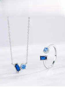 Detail of S925 silver jewelry set featuring blue rectangle and round zircon gemstones