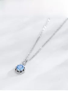 Detail of S925 silver necklace featuring a blue flower pendant with petal base