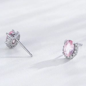 Elegant S925 sterling silver stud earrings featuring oval pink gemstones and white crystals