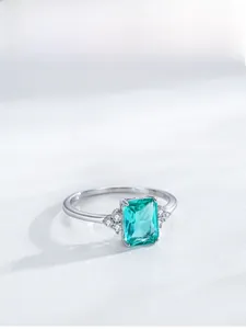 Close-up of S925 silver ring featuring a rectangular emerald-cut teal gemstone
