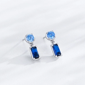 Elegant S925 sterling silver drop earrings featuring blue sapphire and round gemstones