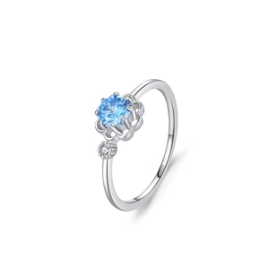 Elegant S925 sterling silver flower ring with blue gemstone and white side stones