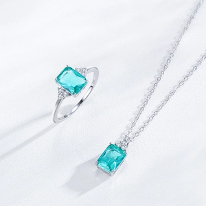Elegant S925 silver necklace and ring set with emerald cut aqua blue stones