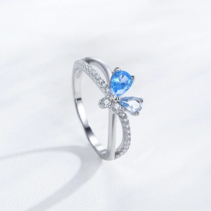 S925 sterling silver bow ring featuring blue pear-cut stones and sparkling crystals