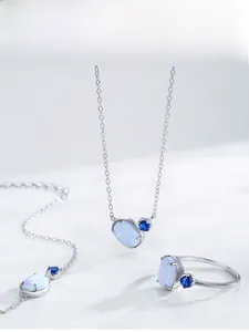 Detailed set of S925 silver jewelry featuring oval opal and blue gemstone accents