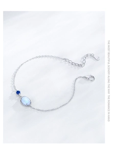 Detail of S925 sterling silver bracelet with blue opal stone and lobster clasp closure