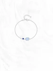 Detailed macro of S925 sterling silver chain bracelet with blue opal and round gemstone