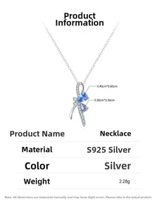 Detail of S925 silver necklace with ribbon bow pendant and blue teardrop gemstones