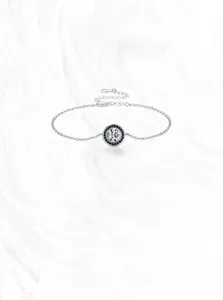 Detailed view of S925 silver round bracelet with white main stone and black zircon border