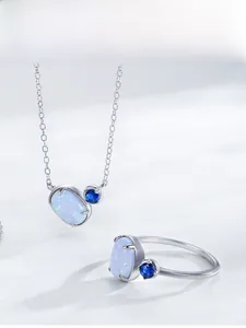 Detail view of S925 sterling silver opal jewelry set including necklace and ring