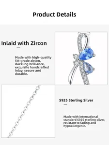Detail of S925 silver bow pendant featuring a blue teardrop zircon and fine inlay