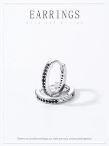 Macro shot of 925 sterling silver hoop earrings with black zircon micro-pave setting