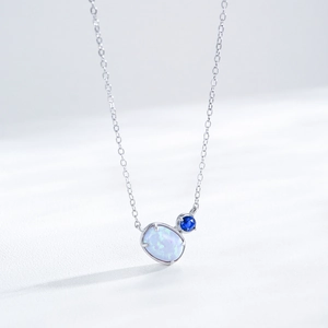 Elegant S925 silver necklace with oval white opal and blue gemstone pendants on chain