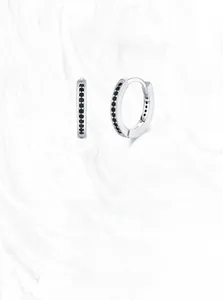 Detailed macro view of S925 sterling silver hoop earrings with black zircon stones