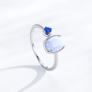 Elegant S925 sterling silver ring featuring a white opal stone and a blue gemstone