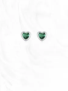 Macro detail of emerald heart stud earrings in S925 sterling silver with green zircon