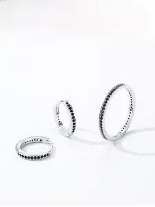 Detailed view of three 925 sterling silver hoop earrings with black zircon pavé