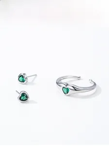 Detailed view of S925 silver set with heart-cut emerald zircon earrings and open ring