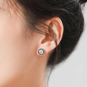 Classic S925 sterling silver stud earrings with black and white zircon halo on ear