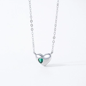 Elegant S925 sterling silver heart necklace featuring a brilliant green gemstone pendant