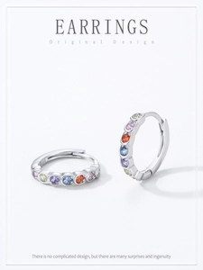 Detail of S925 sterling silver hoop earrings with multicolored rainbow zircon stones