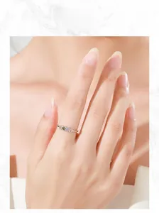 Close-up model display of a 925 sterling silver ring with colorful heart-shaped stones