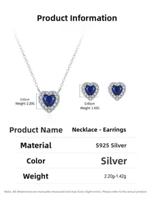 Macro view of blue heart-shaped silver necklace and earrings with product dimensions