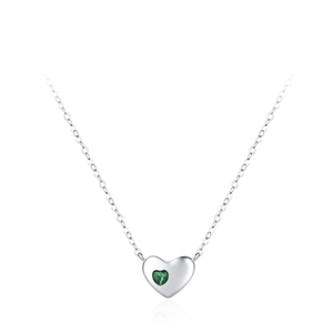 Elegant S925 sterling silver heart necklace with a green gemstone on white background