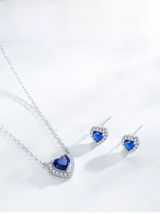 Detail of S925 silver jewelry set featuring heart-cut blue sapphire and pavé diamonds