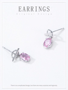 Macro shot of S925 sterling silver pink oval zircon earrings with geometric T-bar design