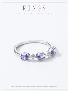 Detailed macro view of S925 sterling silver ring with oval purple and white zircons