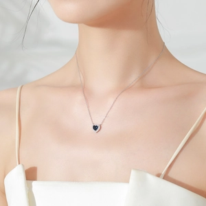 Vintage S925 sterling silver heart necklace with deep blue sapphire-colored gemstone
