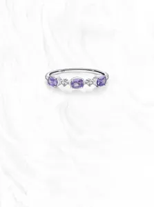 Macro view of S925 sterling silver ring featuring purple zircon stones and small diamonds