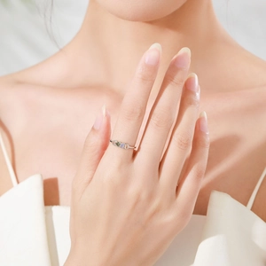 925 silver ring with three colored gemstones on model hand in natural soft lighting