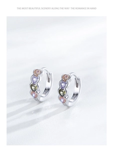 Detailed macro of S925 sterling silver hoop earrings with colorful heart-shaped gemstones
