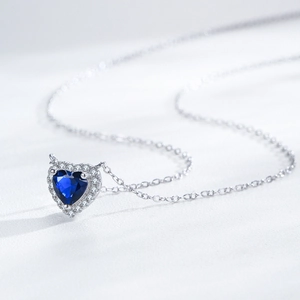 Elegant S925 silver heart necklace with blue sapphire pendant and zircon halo setting