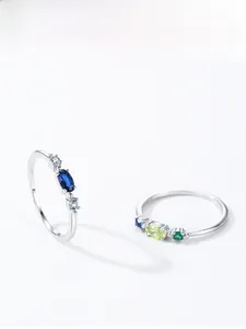 Detail view of 925 silver ring featuring colorful gemstones and fine prong settings