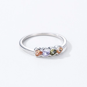 925 silver ring featuring four multi-colored heart gemstones on a polished silver band