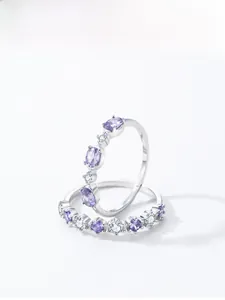 Macro shot of S925 silver ring featuring purple and white zircon crystals in a layered design