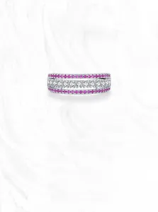 Macro shot of S925 sterling silver ring featuring triple row pink and white gemstones