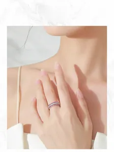 Macro detail of S925 silver ring featuring triple rows of pink and white micro-pave crystals