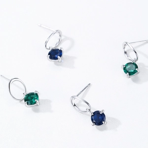 S925 sterling silver stud earrings featuring blue and green round cubic zirconia stones