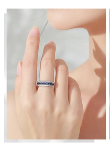 Macro shot of S925 sterling silver ring with blue gems and white zircon inlay details