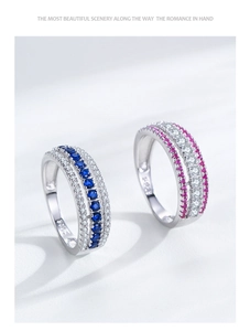 Macro shot of S925 silver ring featuring three rows of blue and pink micro-set cubic zirconia