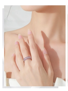 Detail of 925 sterling silver hollow ring featuring pink and white gemstone rows