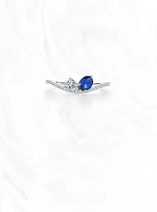 Close-up of S925 silver ring featuring pear-cut sapphire and zirconia stones