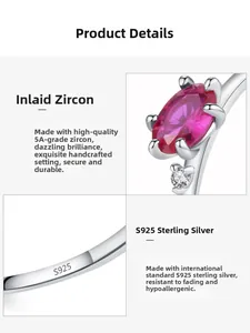 Macro detail of S925 sterling silver ring featuring oval red zircon and clear hallmark