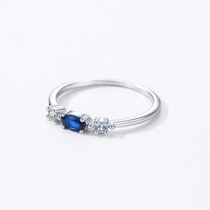 Elegant 925 sterling silver ring with oval blue sapphire and round side zircons