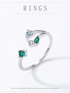 Detail of S925 sterling silver branch ring with green and clear zircon stones